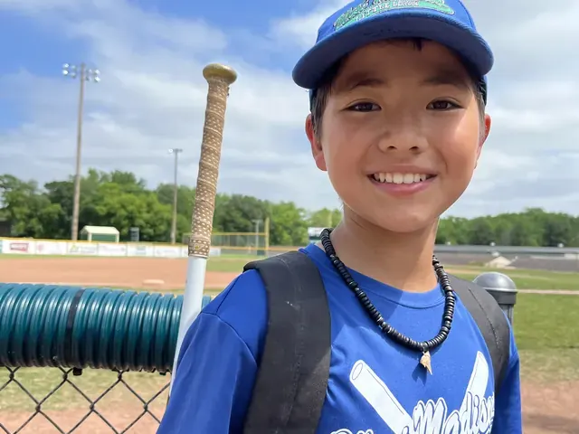 Family photo: young baseball player at the ballpark